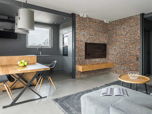 Define an Open Concept Space With Faux Stone Panels